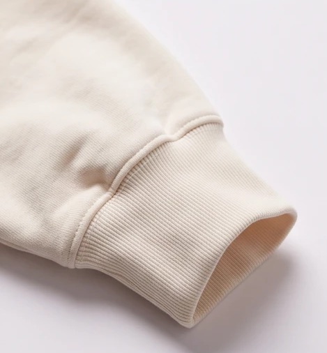 Close-up of a cream ribbed cuff